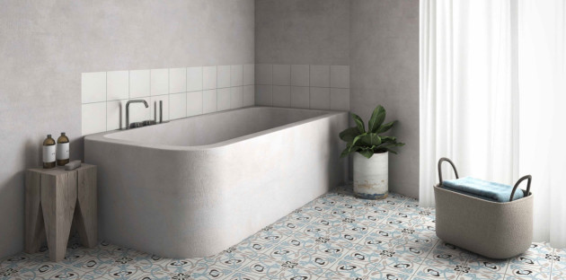 Baignoire style ciment dans une salle de bains avec des carreaux de ciment